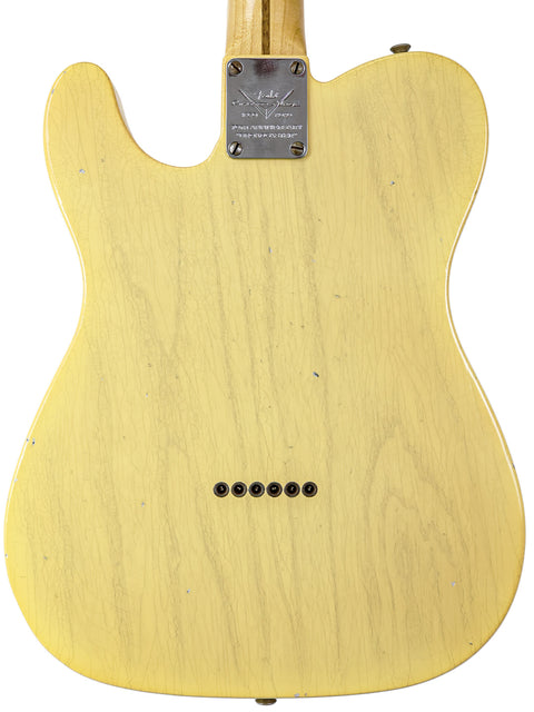 Yellow Fender Custom Shop 70th Anniversary Broadcaster guitar displayed from the back on a white backdrop.