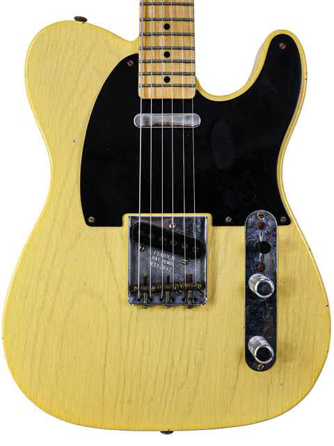 Yellow electric guitar with a black pickup, showcasing the Fender Custom Shop 70th Anniversary Broadcaster from 2020.