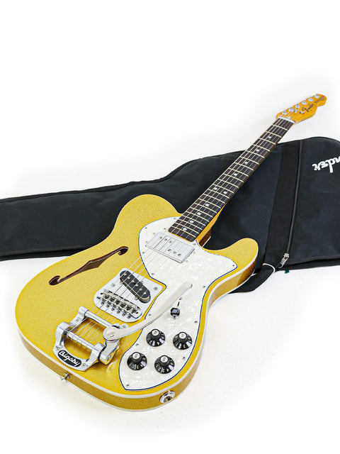 Yellow guitar displayed in a black case, representing the Txxx Custom Thinline '72 Partscaster with B5 Bigsby from 2022.