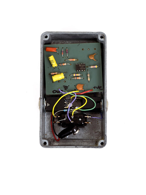 1970s DOD Overdrive Preamp 250, a compact electronic device with wires, capturing the essence of vintage audio gear.