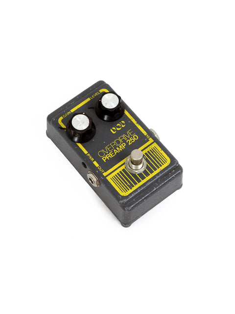 1970s DOD Overdrive Preamp 250 pedal, sporting a vibrant yellow and black label, perfect for vintage gear lovers.