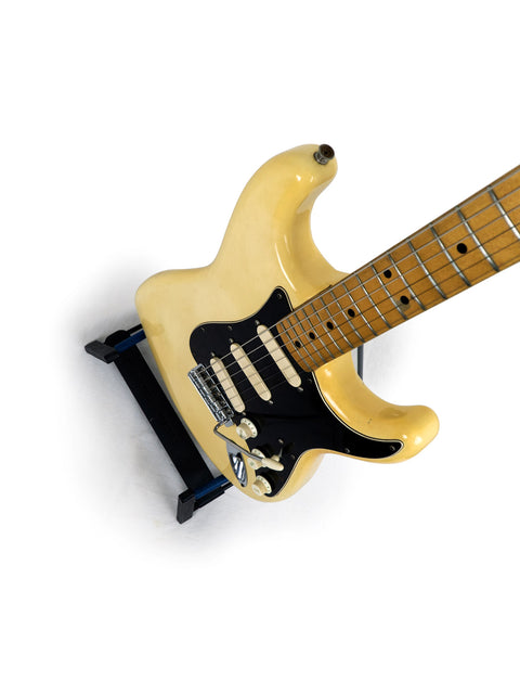 1976 USA-made Fender Stratocaster electric guitar, white body with a contrasting black pick guard.