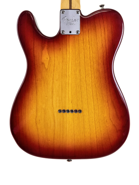 2002 Fender American Standard Telecaster electric guitar equipped with Duncan pickups, known for its timeless style and sound quality.