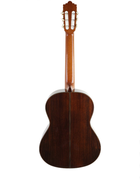 2012 Ramirez 4NE classical guitar showcasing a wooden back and neck, made in Spain.