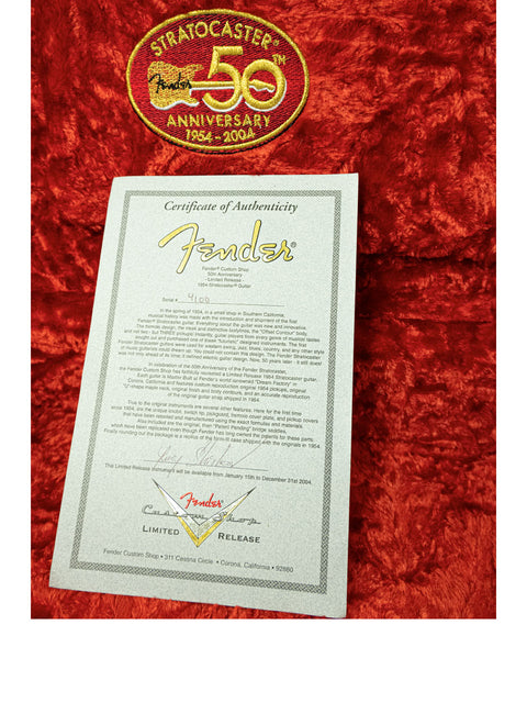 50th anniversary certificate for Fender, showcasing a 2004 Masterbuilt 1954 Strat by Yuriy Shishkov from the Custom Shop.