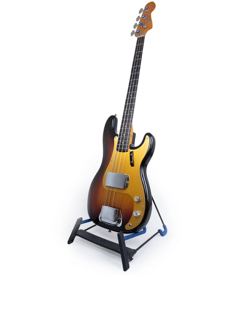A 1958/59 vintage Fender Precision Bass guitar displayed on a stand, featuring a striking white background for emphasis.