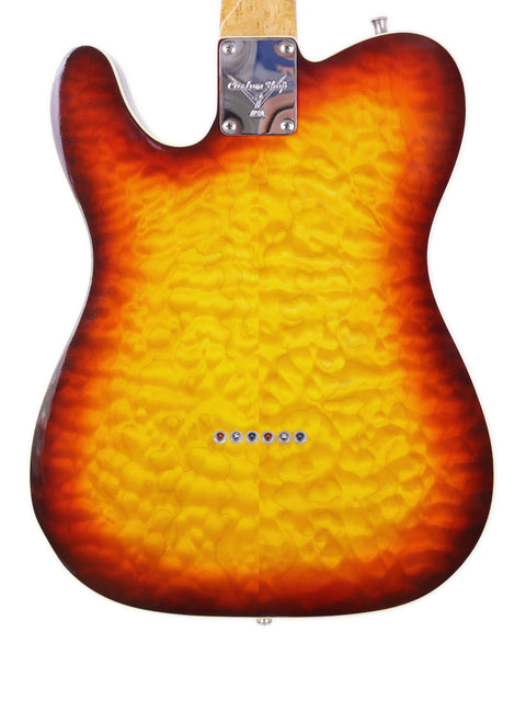 A 1998 Fender Custom Shop 50s Telecaster featuring a striking sunburst finish, highlighting its vintage appeal.