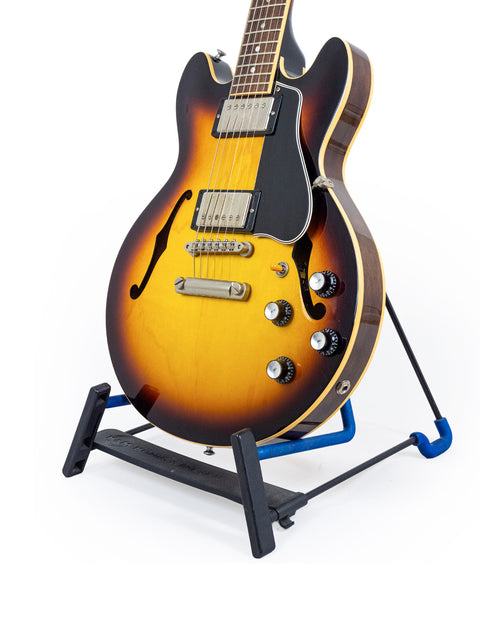 A 2009 Gibson Custom Shop ES 339 Memphis guitar displayed on a stand with a white backdrop.