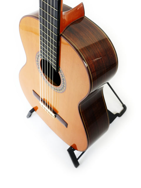 A 2012 Ramirez 4NE guitar from Spain, prominently featured on a white background.