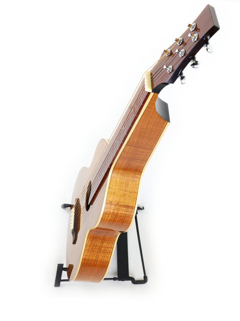 A 2014 Gilet WB guitar in Weissenborn style rests on a stand, set against a simple white backdrop.