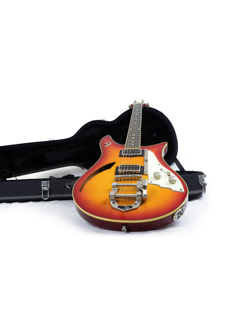 A Duesenberg Double Cat guitar from 2007, nestled in its case, displayed on a pristine white background for a striking look.