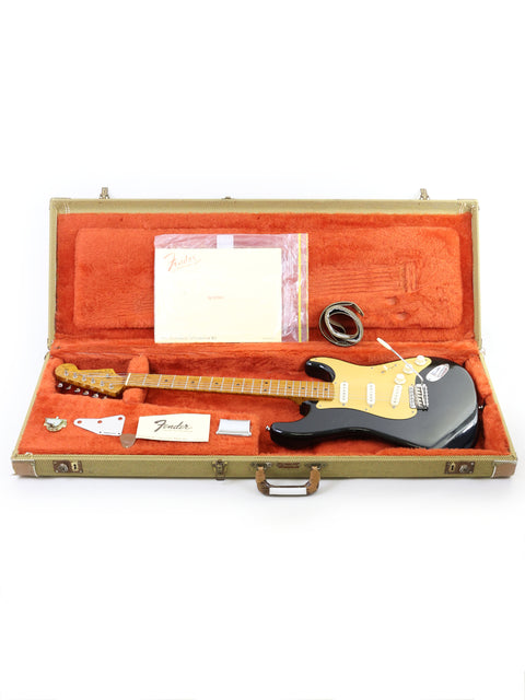 A Fender AVRI ‘56 Stratocaster guitar securely placed in a case, emphasizing its vintage appeal and craftsmanship from USA 2012.