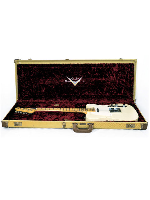 A Fender Telecaster electric guitar displayed in an elegant gold case, featuring the 2006 Chris Fleming Masterbuilt design.