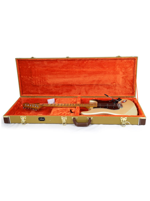 A Fender Telecaster electric guitar, highlighting its iconic shape and features, reminiscent of the 1979 Anniversary Stratocaster.