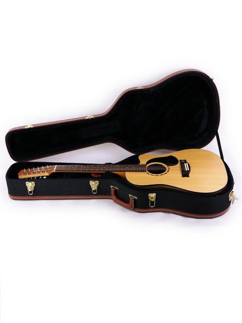 A Maton EM425C 12-string guitar nestled in a wooden case, representing Australian craftsmanship from 2009.