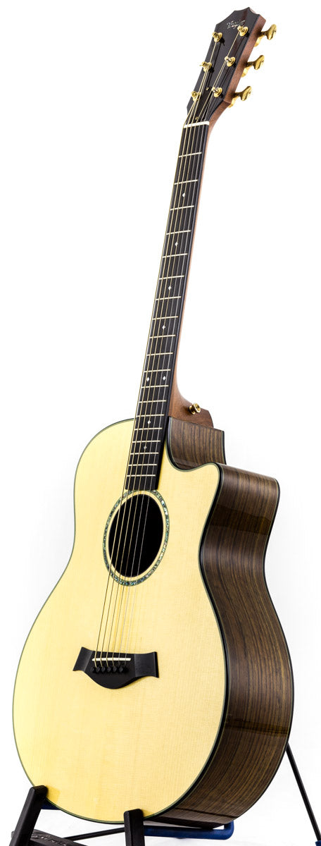 A Taylor Custom GS Baritone 6 guitar, made in the USA in 2011, displayed on a stand for all to admire.