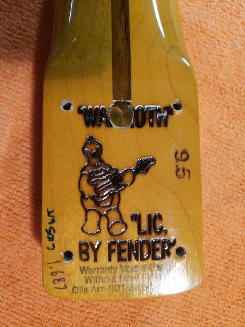 A Warmoth Strat Partscaster from 2012, highlighted by a sticker that reads "w l c fender" on its body.