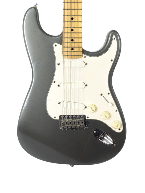 A black Fender American Standard Stratocaster, showcasing its sleek design and iconic features, perfect for any guitarist.