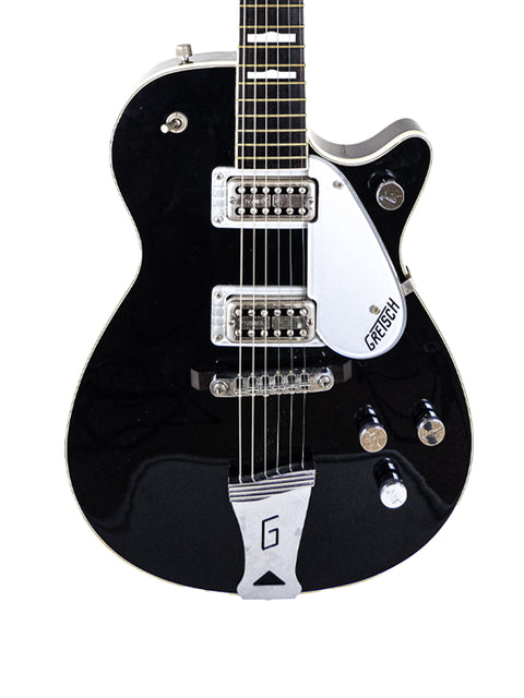 A black Gretsch G-60S guitar, model Duo Jet 6128, crafted in Japan in 1989, showcasing its sleek design and vintage appeal.