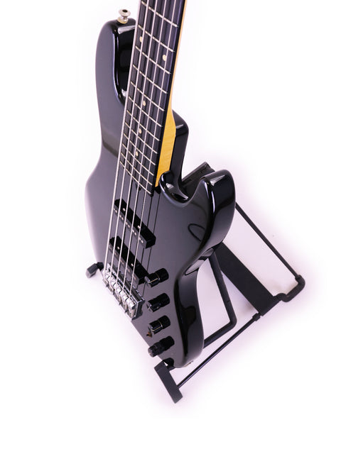 A black Sadowsky NYC Jazz Bass 5 String guitar on a stand, set against a bright white background.