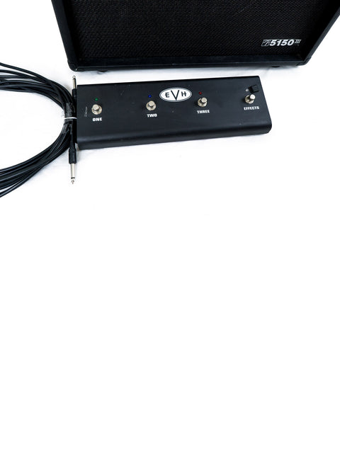 A black amplifier, the EVH 5150 III, with a cable plugged in, representing high-quality sound equipment for musicians.