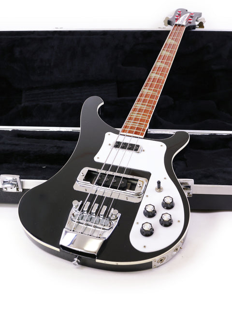 A black and white Rickenbacker 4003 Jetglo bass guitar securely housed in a case, highlighting its 2008 USA craftsmanship.