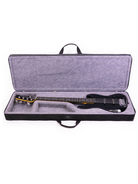 A black guitar case features a Sadowsky NYC Jazz Bass 5 String guitar from 2000, blending elegance with musical heritage.