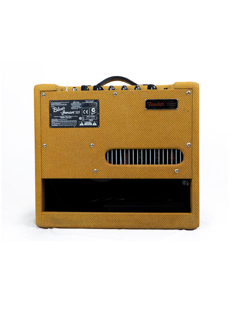 A bright yellow Fender Blues Junior III Limited Edition guitar amplifier set against a stark white background, highlighting its design.