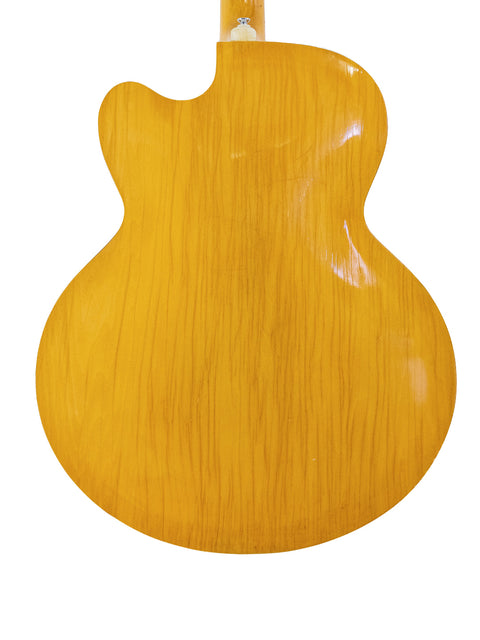 A bright yellow Sutton Archtop guitar from the 1970s displayed on a plain white background.