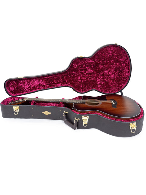 A brown guitar case next to a red one, highlighting the Taylor 326 CE Baritone 8 LTD, USA edition from 2020.