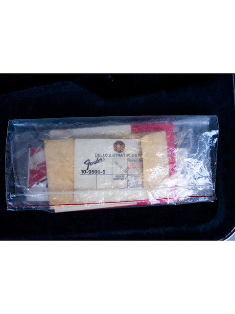 A cigarette pack wrapped in a clear plastic bag, focusing on the packaging and its compact form.