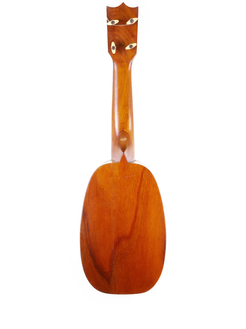 A classic 1928 Kamaka Pineapple Style #3 ukulele displayed on a white background, showcasing its wooden craftsmanship.