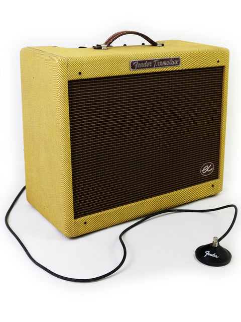 A close-up of the Fender Hot Rod Deluxe Reverb, highlighting its controls and stylish design, a favorite among guitarists.