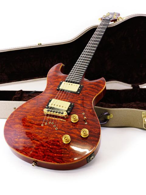 A guitar with a wooden body and case, featuring the label Jarrett Forza, Serial #00001, from the USA, 2007.