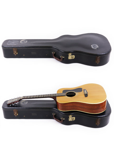 A pair of guitars in their cases against a white backdrop, showcasing a 1974 Guild D-50 Bluegrass Special from the USA.