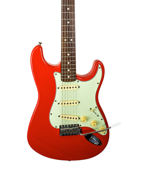A red Fender American Vintage 62 Strat electric guitar with a white pickguard, showcasing its classic Fiesta Red finish.