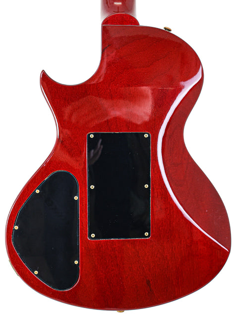 A red Gibson Nighthawk guitar with a black pickguard, showcasing its sleek design from the USA, 1997 model year.