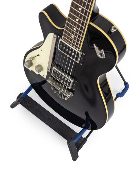 A sleek black Duesenberg 49er Solid Body guitar (2014) adorned with a vibrant blue strap, perfect for any musician.