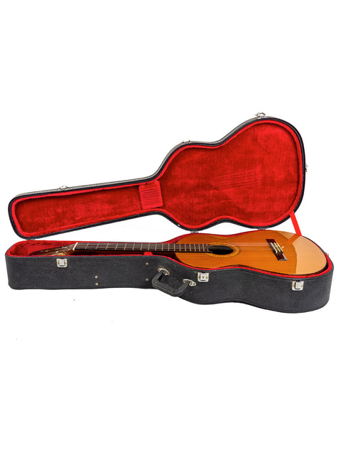 A striking red and black guitar case featuring a K Yairi YC90 Concert Classical Guitar, crafted in Japan in 1987.