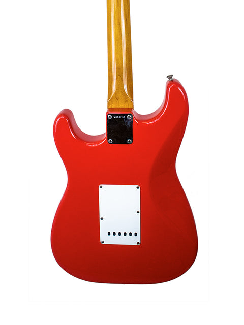 A striking red electric guitar with a wooden body, showcasing the 1996 Fender American Vintage 62 Strat in Fiesta Red.