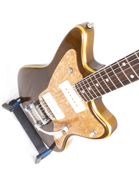 A stunning brown guitar with gold hardware, the Zachary & Mercer Mastermind “Deluxe” Offset, crafted in Aust 2021.