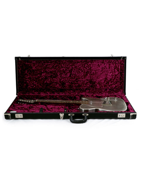 A stylish James Trussart Holey Nickel Steelcaster guitar in its case, displayed on a pristine white surface.