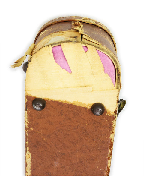 A suitcase adorned with a pink and brown paint scheme, echoing the vintage charm of a 1954 Gibson J-200.