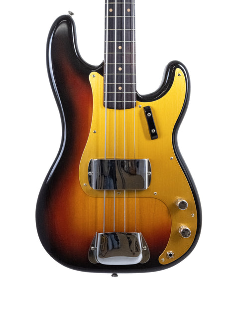 A sunburst-finished vintage Fender Precision Bass, representing the iconic style of the USA-made 1958/59 model.