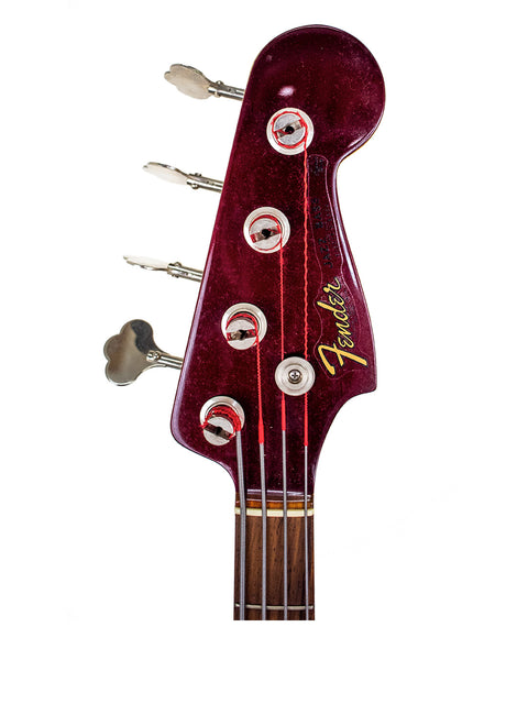 A vibrant red Fender Jazz Bass, model '62 Reissue from the Custom Shop, USA, crafted in 2001, highlighting its iconic style.