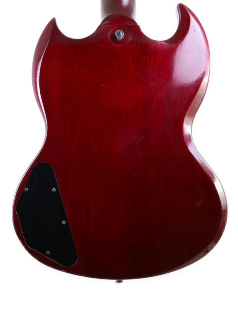 A vibrant red Gibson SG '61 Reissue guitar, USA-made in 1988, highlighted by a stylish black pickguard.