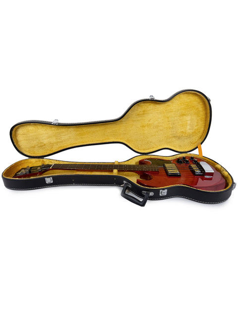 A vibrant red guitar case with a black headstock, highlighting the classic Ibanez 2403B Lawsuit Bass from 1976.