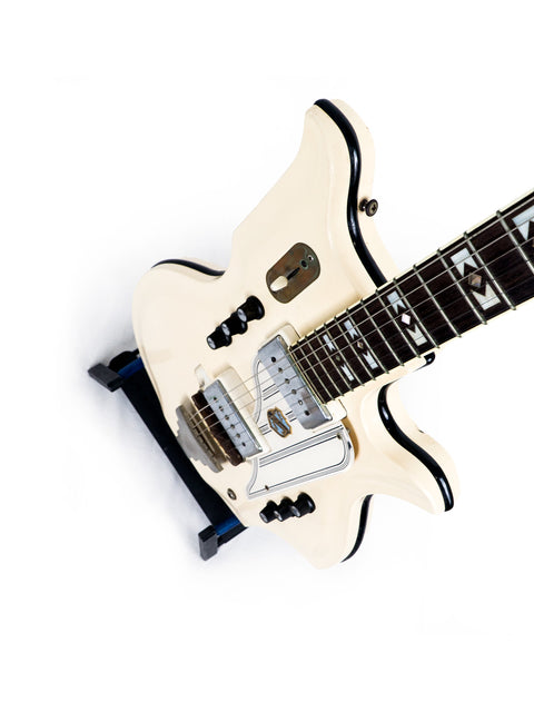 A vintage 1962 National Valco Glenwood Model 99 electric guitar, white with a black pickguard.
