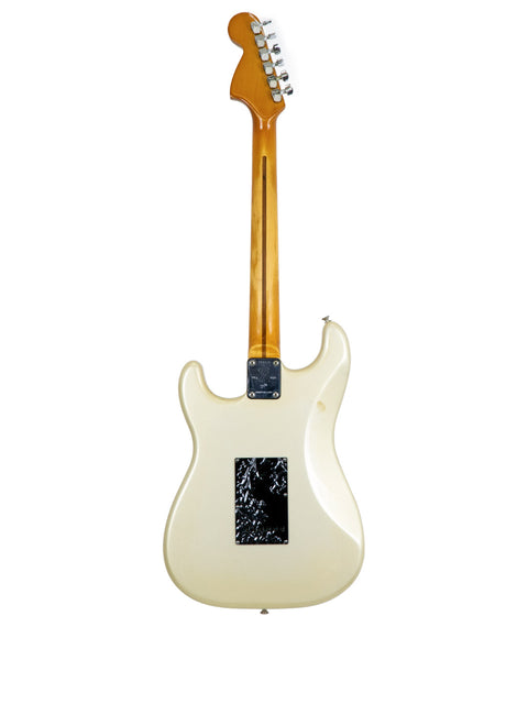 A vintage 1979 Fender 25th Anniversary Stratocaster, featuring a white body and a striking black pickguard.