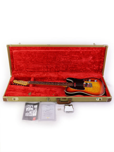 A vintage Fender Custom Shop 50s Telecaster guitar nestled in a red case, representing craftsmanship from the USA, 1998.